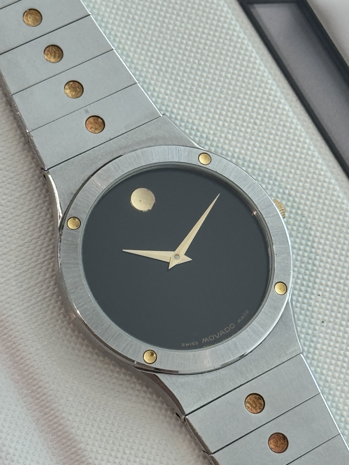Original watch face and dial photograph of Movado Black Museum Dial Stainless Steel Watch with Gold-Tone Accents