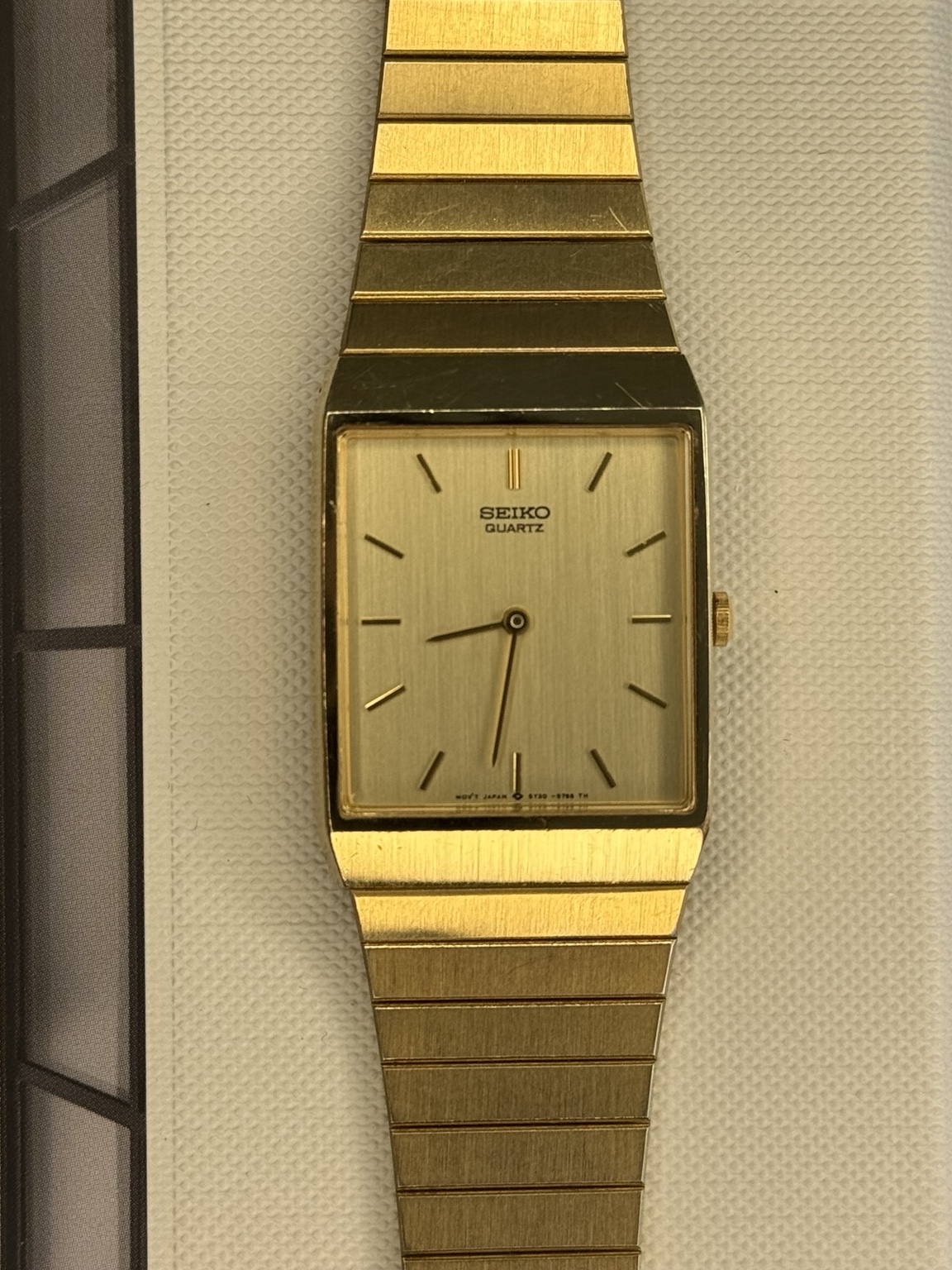 Original watch face and dial photograph of Seiko Quartz Gold-Tone Rectangular Integrated Bracelet Dress Watch – 5Y30-5390