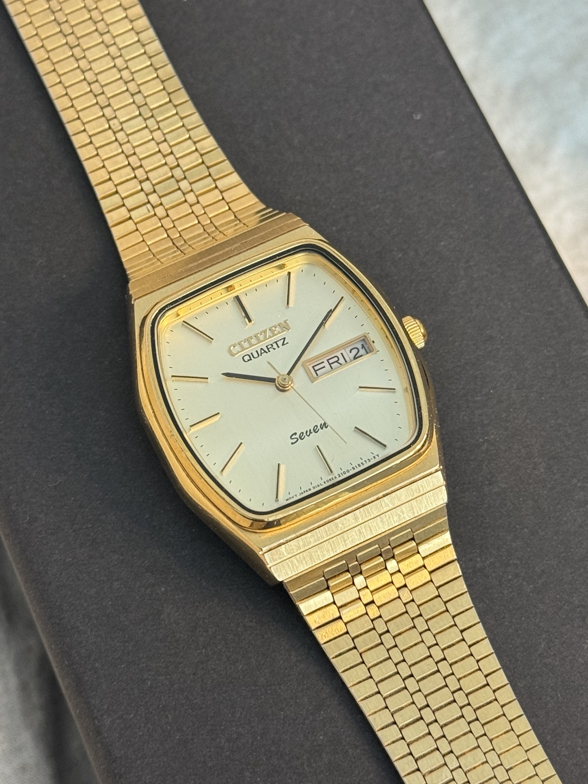 Original watch face and dial photograph of Citizen Quartz Seven Gold-Tone Cushion Case Day-Date Watch