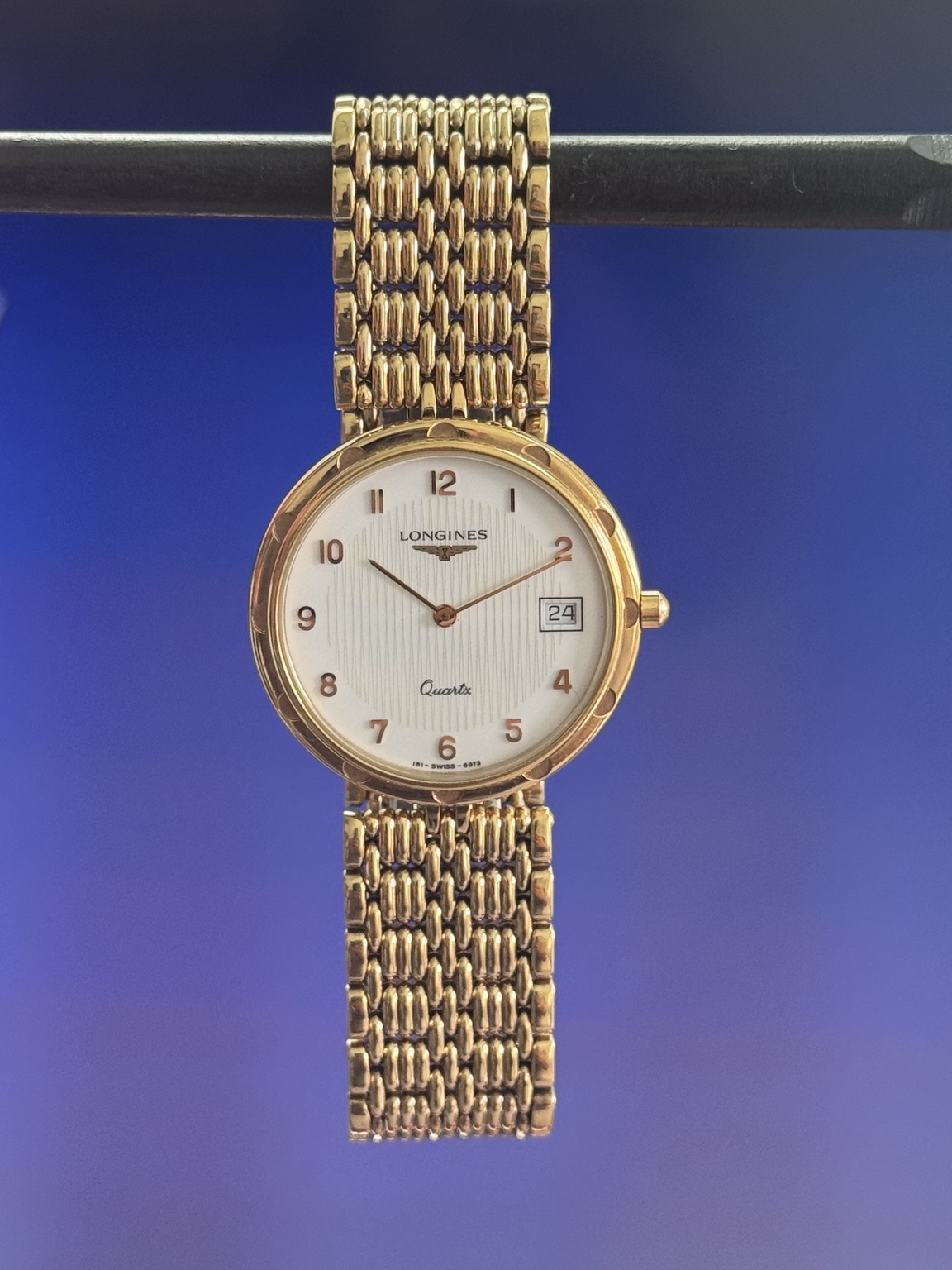Original watch face and dial photograph of Longines Quartz Gold-Tone Dress Watch with Date & Integrated Bracelet